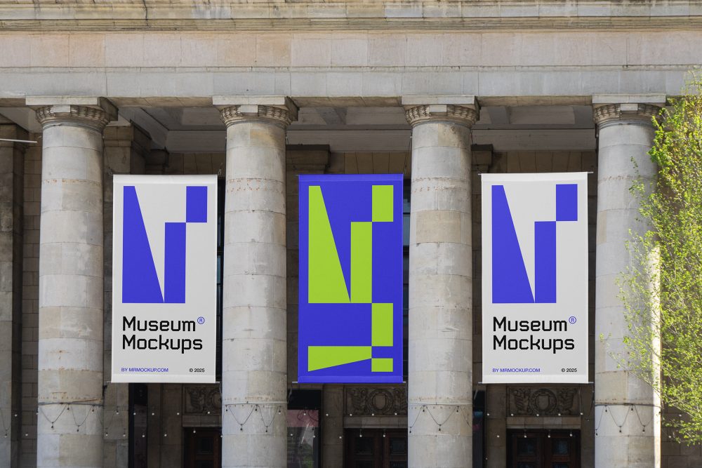 Front view, Three Hanging Banner Mockups with white, purple, and neon green geometric designs on an old building elevation, just above the entrance. Scene from our Museum Mockups product.