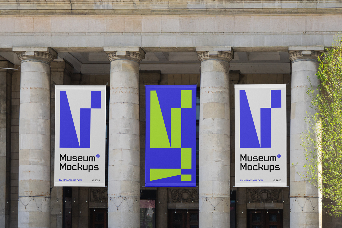 Front view, Three Hanging Banner Mockups with white, purple, and neon green geometric designs on an old building elevation, just above the entrance. Scene from our Museum Mockups product.