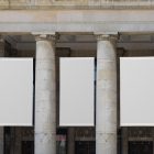 Front view, Three White Hanging Banner Mockups on an old building elevation, just above the entrance. Scene from our Museum Mockups product.