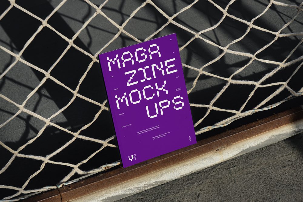 Front view, of outdoor magazine mockups with strong purple typography design resists on string net.