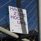 Front view, of outdoor magazine mockups with strong purple typography design resists on string net.