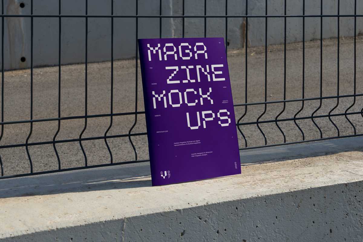 Front view, of outdoor magazine mockups with strong purple typography design resists on metal net fence in black color.