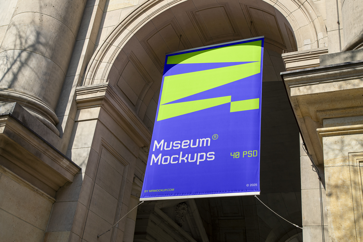View from below, Hanging Banner Mockup with white, purple, and neon green geometric design holding on to ropes attached to the building. Scene from our Museum Mockups product.