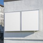 Front view, Two White Banner Mockups attached to the building elevation. Scene from our Museum Mockups product.
