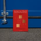 Front view, of outdoor magazine mockups with simple minimalist design in black and red color, serif typography, and square foil pattern resist on the blue container color.