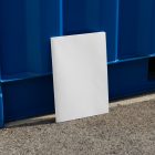 Front view, of a white outdoor magazine mockup resist on the blue container color.