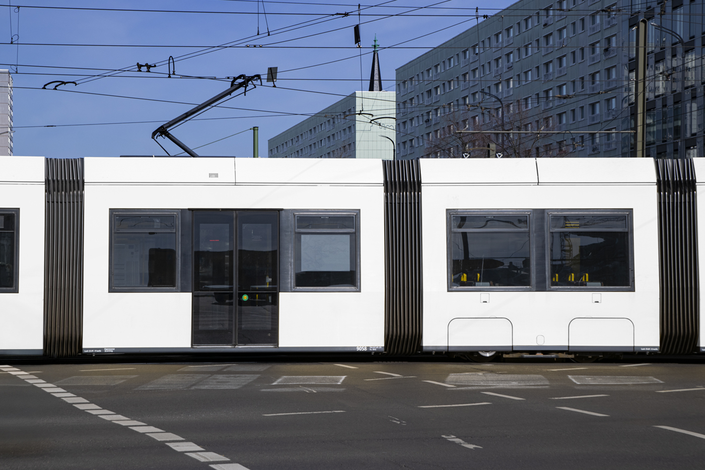 Front View side of blank City Tram Mockup against the city view.