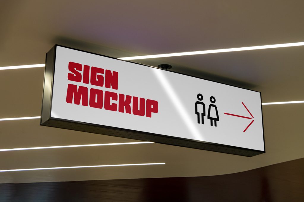 Front view, Horizontal Signage Mockup with black metal frame and red, black design hangs from the ceiling.