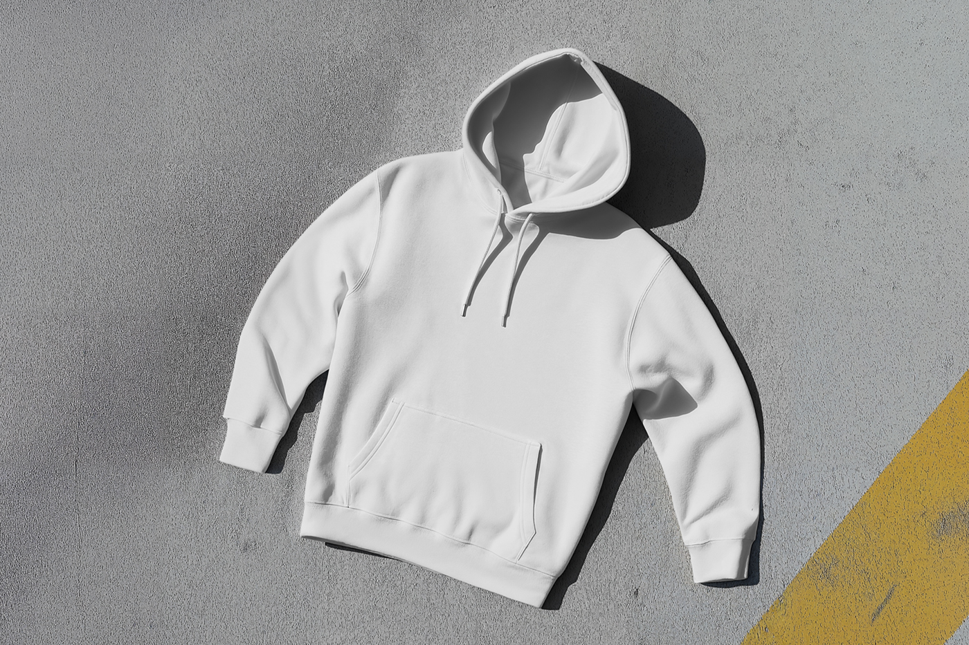 Laying a White Hoodie Mockup on the gray color floor.