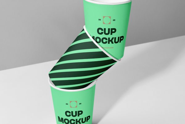 Front view, Three Coffee Cup Mockups with strong geometric typography logo in dark green color standing on the bright gray background.