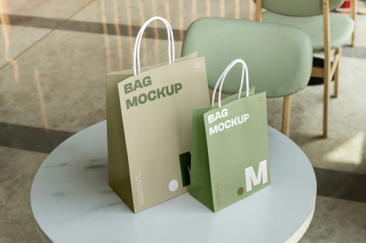 Front view, Two Paper Shopping Bag Mockups with bright gold and green typography design standing on the restaurant marble table.
