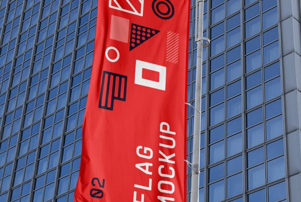 Front view single Red Waving Flag Mockup against big city building.