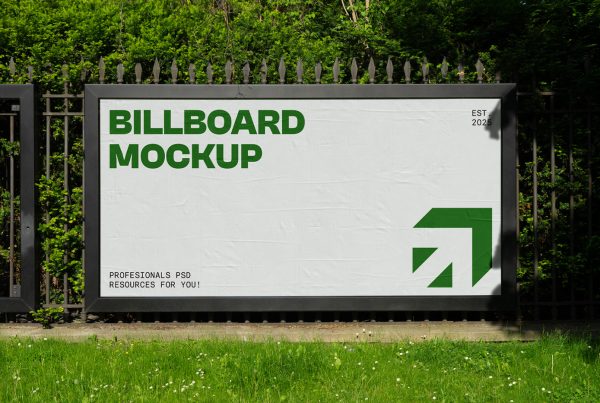 Front view, Wide Outdoor Billboard Mockup attached to the metal fence against the city garden.