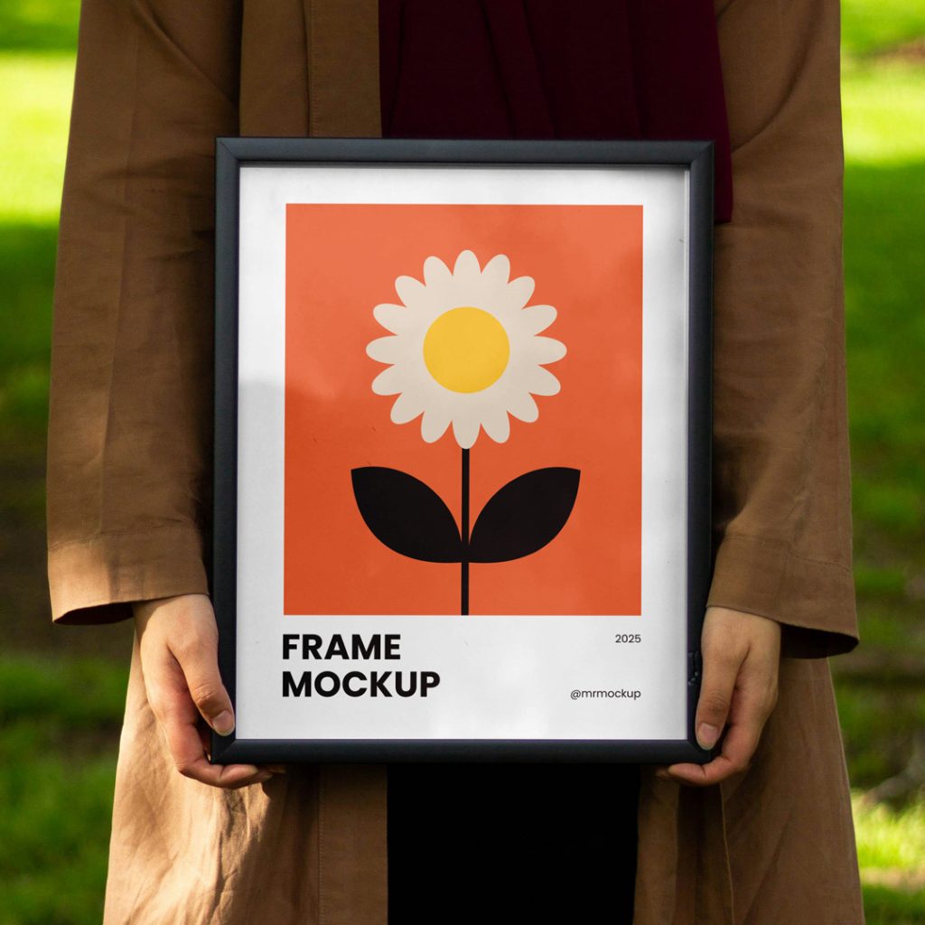 Front view, women holding a framed poster mockup in hands with simple illustration design against the background of the park.