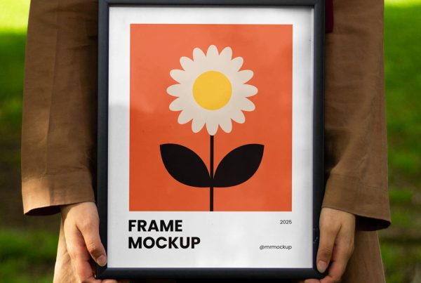 Front view, women holding a framed poster mockup in hands with simple illustration design against the background of the park.