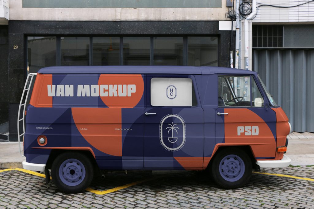 Front view, transporter van mockup with colorful design on the whole truck parked against the building.
