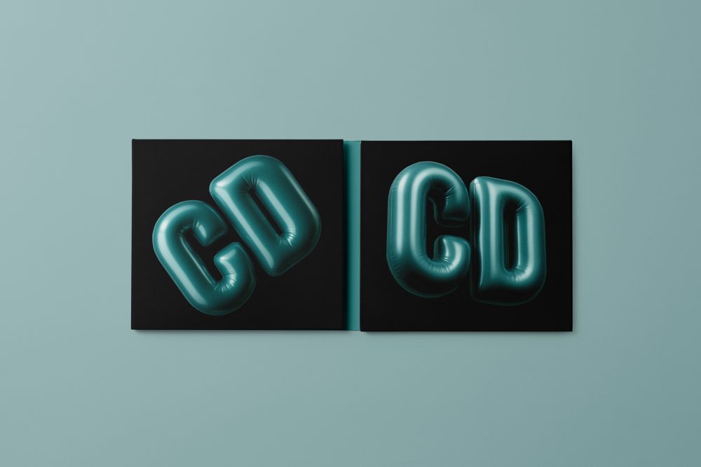 Viewed from above, CD Digipack Mockups presents a green and black disc package with 3D graphics lying on the green background.