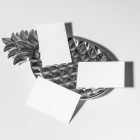 Front view, three white business card mockups. Lying on the white background or on a silver pineapple shaped metal plate.