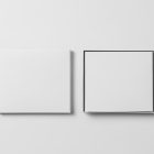 Viewed from above, CD Digipack Mockups presents two white disc packages lying on the white background.