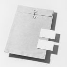 Front view, stationery mockups. Close white envelope mockup and two white business card mockups lying on it. Everything is lying on a white background.