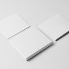 Viewed from above, CD Digipack Mockups presents three white disc packages lying on the white background.