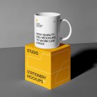 Front view, stationery mockups of a yellow square box mockup with strong geometric typography and white stroke lines, and the white cup mockup with strong black typography and the stationery mockups logo placed on it. Everything is lying on a gray background.