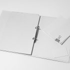 Front view, stationery mockups. Open white binder mockup with a white A4 card mockup and white business card mockups lying on it. Everything is lying on a white background.