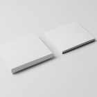 Viewed from above, CD Digipack Mockups presents two white disc packages lying on the white background.