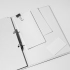 Front view, stationery mockups. Open white binder mockup with a white A4 card mockup, white business card mockups, a white leaflet mockup, and a white square card mockup lying on it. Everything is lying on a white background.