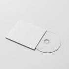 Viewed from above, CD Digipack Mockups presents white disc packaging and a white ejected disc lying on the white background.