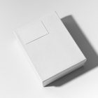 View from above, white box mockup with a visible white business card mockup lying on it. Everything is lying on a white background.