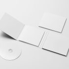 Viewed from above, the composition of CD Digipack Mockups presents three white packages lying on the white background.