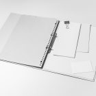 Front view, stationery mockups. Open white binder mockup with a white A4 card mockup, white business card mockups, a white leaflet mockup, and a white square card mockup lying on it. Everything is lying on a white background.