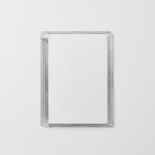 Viewed from above, DVD Mockups presents an close white plastic package lying on the white background.