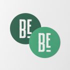 Viewed from above, two circle beer pad mockups in two green shades and a white condensed logo lying on the white background.