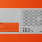 Viewed from above, Vinyl Mockups presents an open music album cover in a gray color with a metal fence graphic and orange label with black frames lying on an orange background.