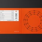 Viewed from above, Vinyl Mockups presents an open music album cover in an orange color with a metal fence graphic and white label with black frames lying on an black background.