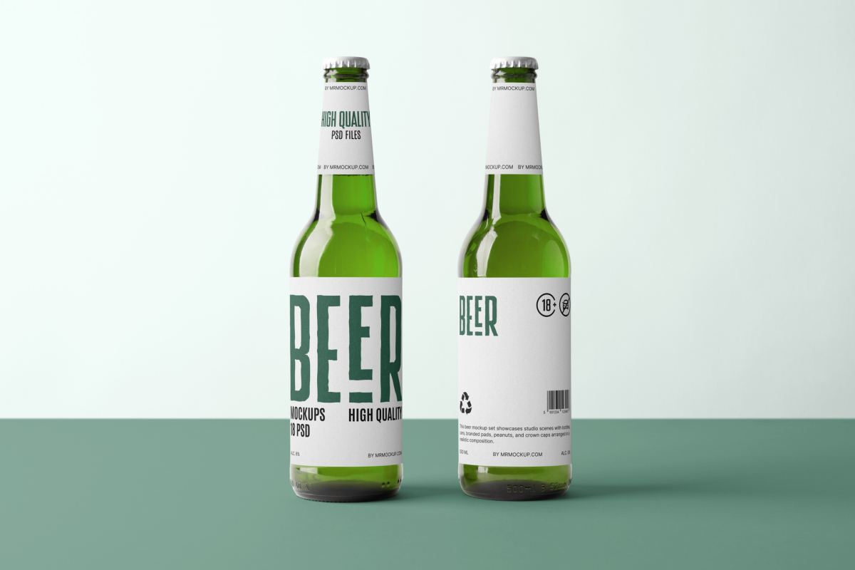 Front view, two beer bottle mockups with white labels and black and dark green designs standing on the green floor.