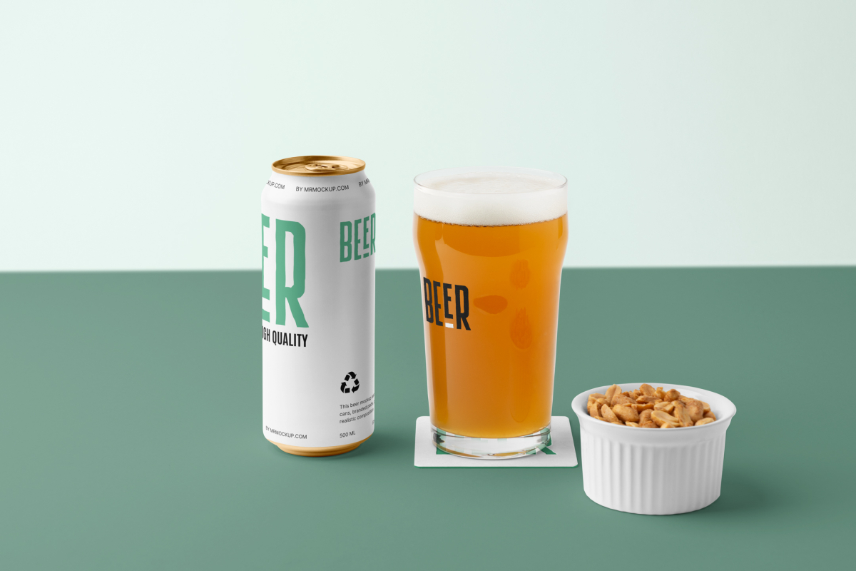 Front view of a standing white beer can mockup with a black and green typography design, a transparent beer glass mockup with a black logo, and a white peanut container standing on the green background floor.