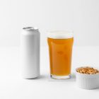 Front view of a standing white beer can mockup, a transparent beer glass mockup, and a white peanut container standing on the white background floor.
