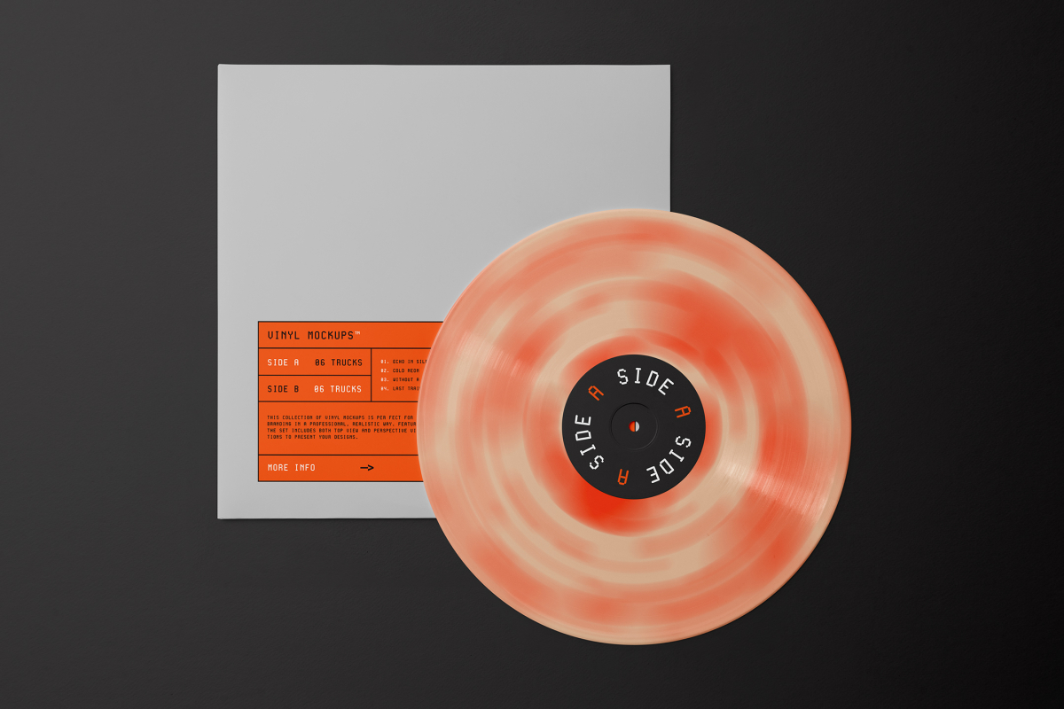 Viewed from above, Vinyl Mockups presents a square music album cover in a gray color with an orange label with a black frame and an ejected vinyl disc with pressed graphics in two colors lying on a black background.
