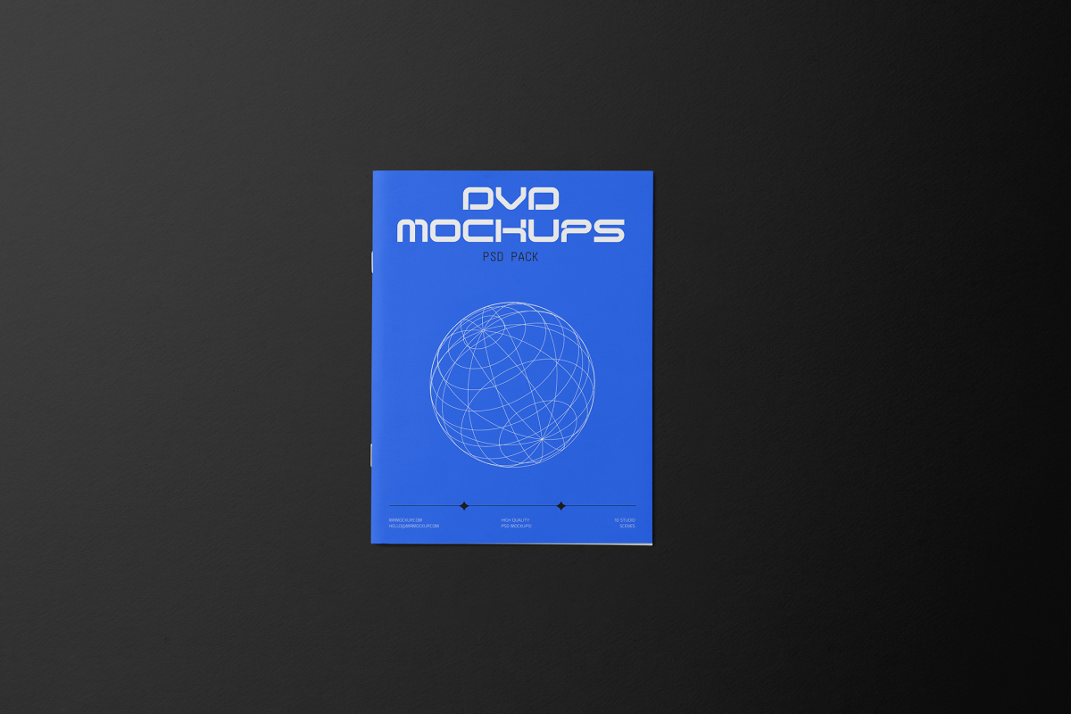 Viewed from above, DVD Mockups presents a blue paper booklet with white typography and linear graphics lying on the black background.