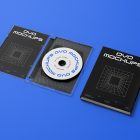 Viewed from above, DVD Mockups presents an open, transparent plastic package and a black paper box. Both of them have nice white typography and linear graphics lying on the blue background.