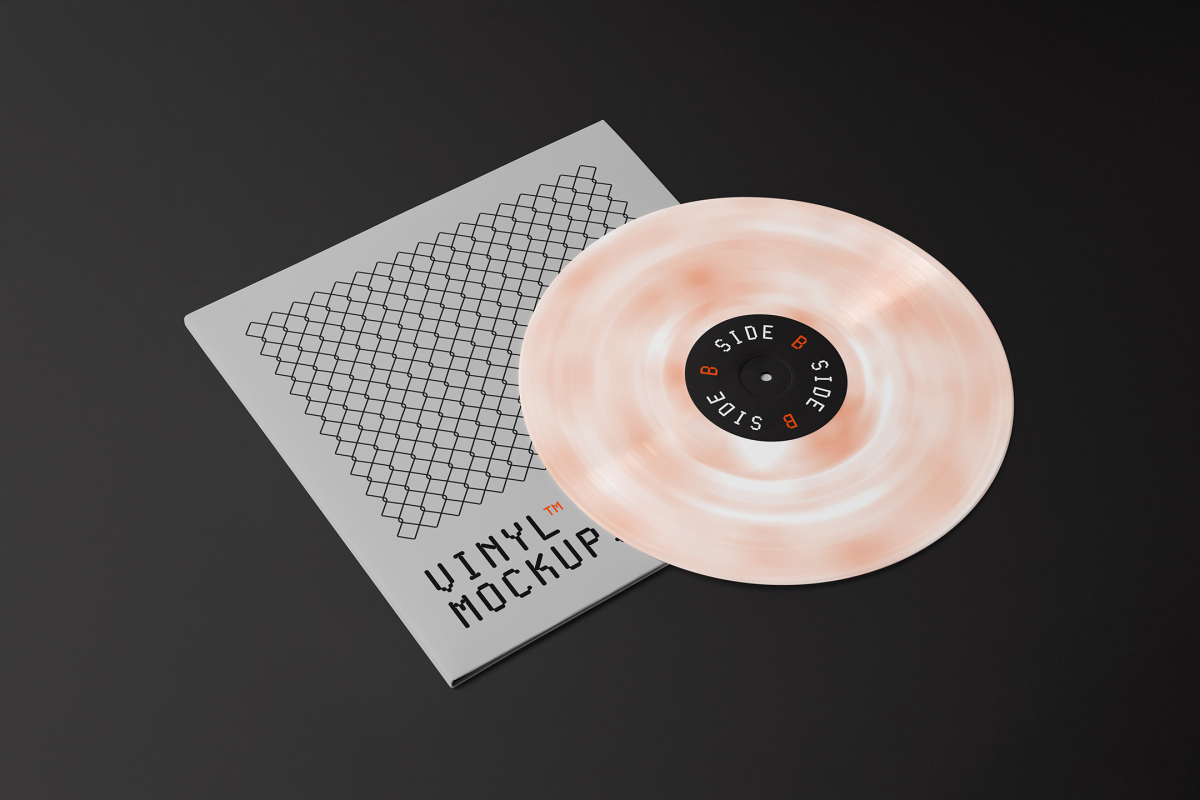 Viewed from above, Vinyl Mockups presents a square music album cover in a gray color with a metal fence graphic and an ejected vinyl disc with pressed graphics in two colors lying on a black background.