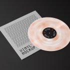 Viewed from above, Vinyl Mockups presents a square music album cover in a gray color with a metal fence graphic and an ejected vinyl disc with pressed graphics in two colors lying on a black background.