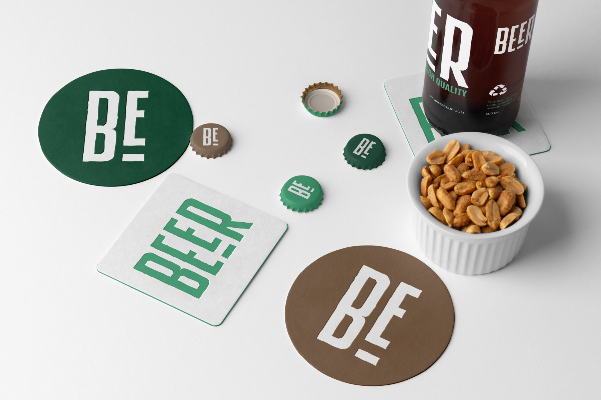 View from above, four beer pad and crown cup mockups with big white or green typography logo designs, a beer bottle mockup, and a white peanut container lying on the white background.