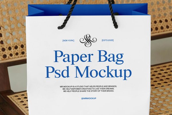 Front view, paper bag mockup with black and blue typography design standing on the vintage chair.