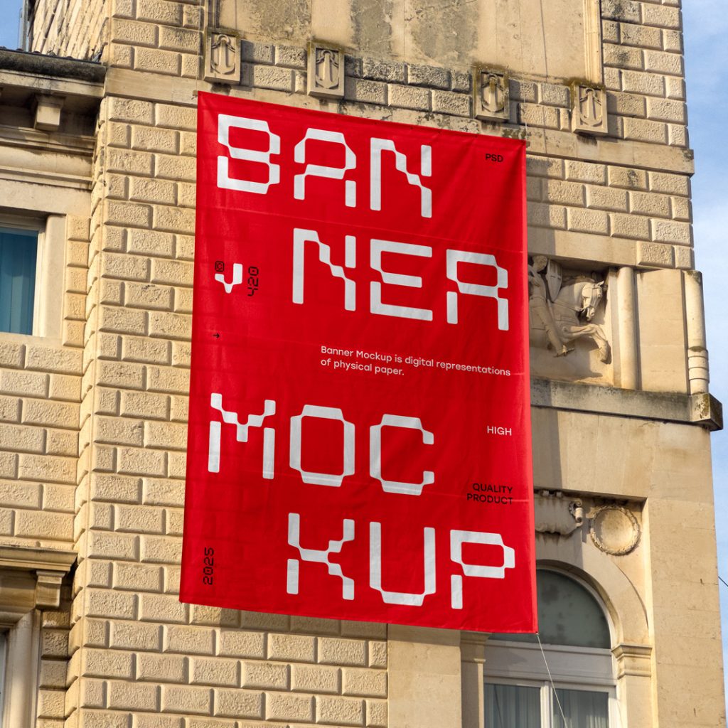 Front view, vertical red banner mockup with strong white and black typography design hanging on the building facade.