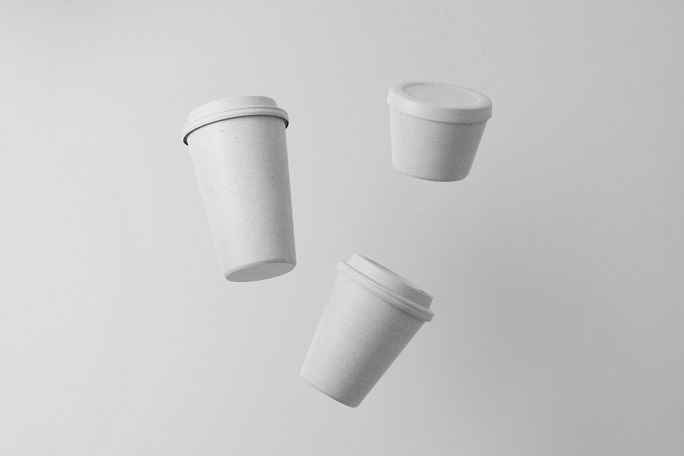 Levitating white paper coffee cup mockup composition on the white background.