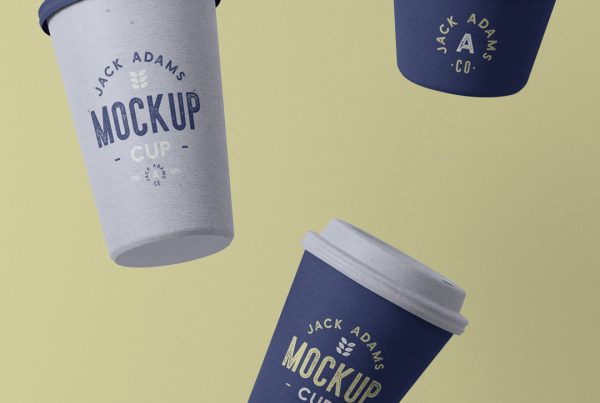Levitating paper coffee cup mockup in three blue tints with a vintage typography design composition on the beige background.